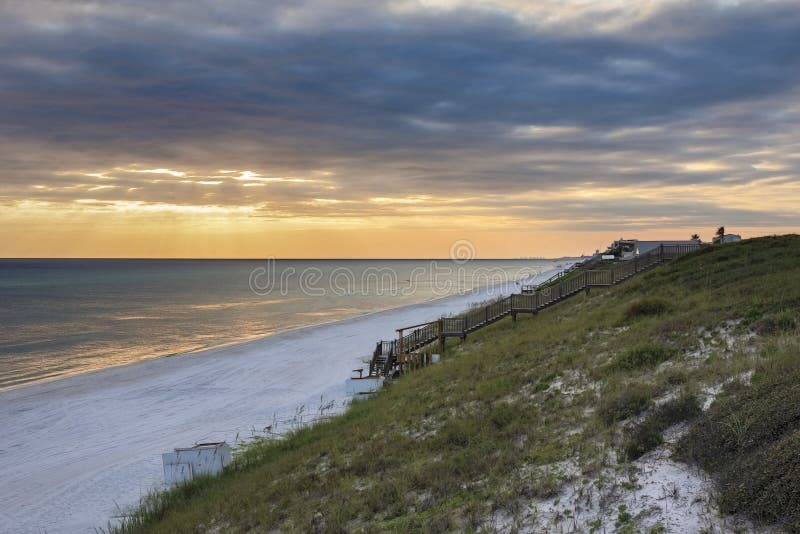 Beautiful sunset along the beaches of scenic HWY 30a in South Walton County, Florida, USA. Near Seaside, Rosemary beach, Alys beach. Beautiful sunset along the beaches of scenic HWY 30a in South Walton County, Florida, USA. Near Seaside, Rosemary beach, Alys beach.