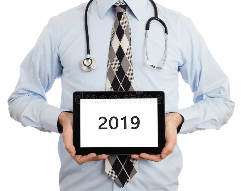 De tablet van de artsenholding - 2019 stock afbeelding De tablet van de artsenholding - 2019 stock afbeelding