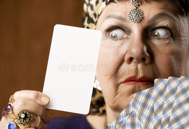 Gypsy fortune teller hiolding a blank tarot card. Gypsy fortune teller hiolding a blank tarot card