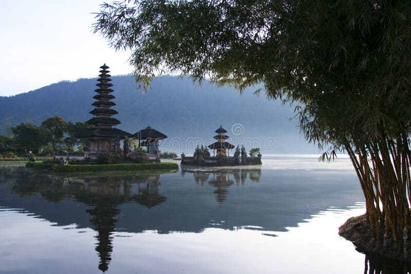Pura Ulun Danu temple framed by bamboo on lake brataan, bali, indonesia. Pura Ulun Danu temple framed by bamboo on lake brataan, bali, indonesia