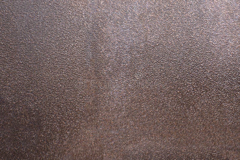 De textuur van de bruine structuur van de metaaldeur stock afbeeldingen De textuur van de bruine structuur van de metaaldeur stock afbeeldingen