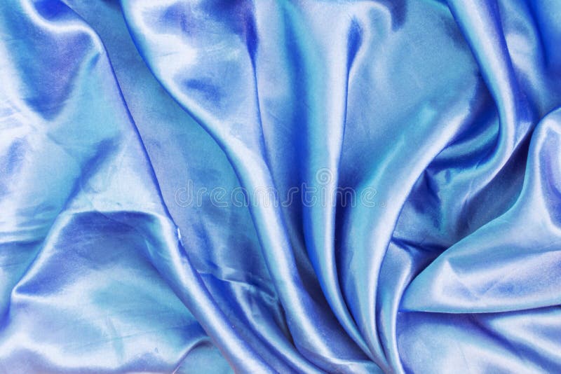De textuur van de donkerblauwe zijdestof is gevouwen Abstracte achtergrond voor lay-outs royalty-vrije stock afbeelding De textuur van de donkerblauwe zijdestof is gevouwen Abstracte achtergrond voor lay-outs royalty-vrije stock afbeelding