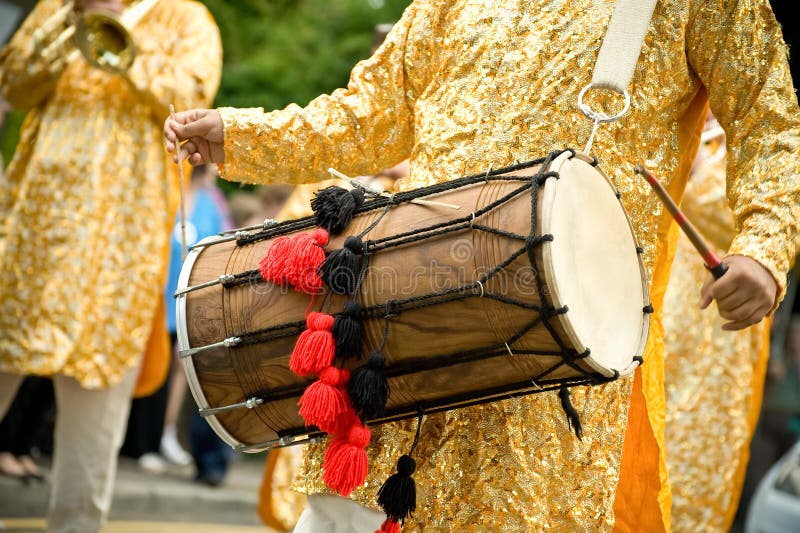 Musician playing a traditional asian dhol drum. Musician playing a traditional asian dhol drum