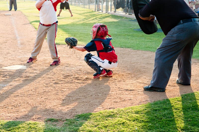 Little league baseball catcher during a game. Little league baseball catcher during a game.