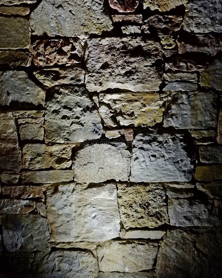 De verlichte achtergrond van de steenmuur, ruimte voor het typen stock afbeelding De verlichte achtergrond van de steenmuur, ruimte voor het typen stock afbeelding