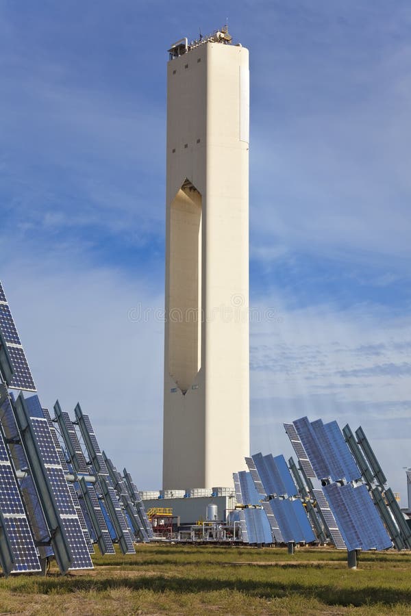 Solar tower surrounded by solar panels harnessing the sun's rays to provide alternative renewable green energy. Situated in Adalucia, Spain, just outside Seville. Solar tower surrounded by solar panels harnessing the sun's rays to provide alternative renewable green energy. Situated in Adalucia, Spain, just outside Seville.