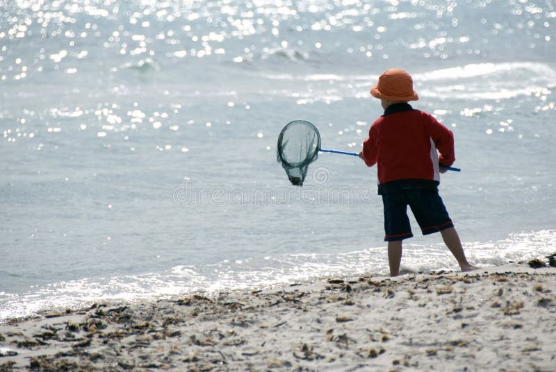 Boy fishing on the beach. Boy fishing on the beach