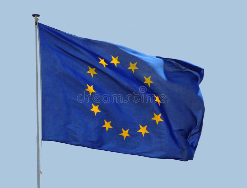 European Union flag fluttering in a brisk breeze against a blue sky. European Union flag fluttering in a brisk breeze against a blue sky.