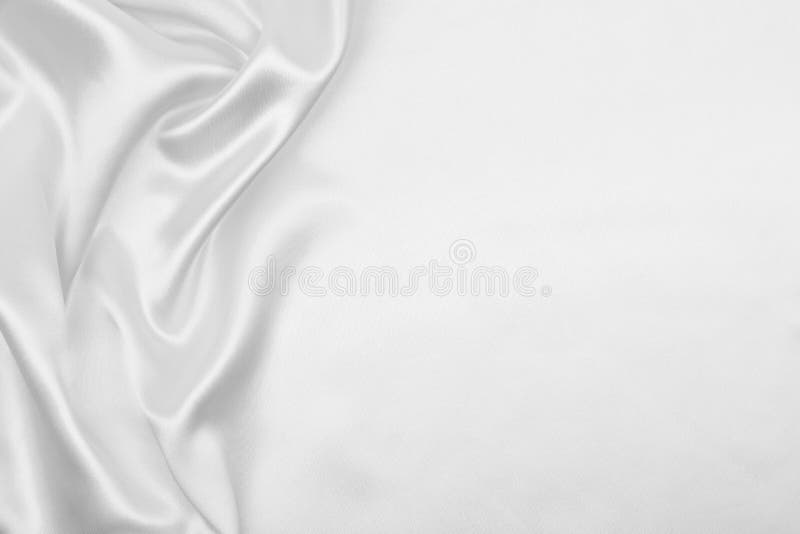 De vlotte elegante witte zijde of satijntextuur van de luxedoek als weddi
