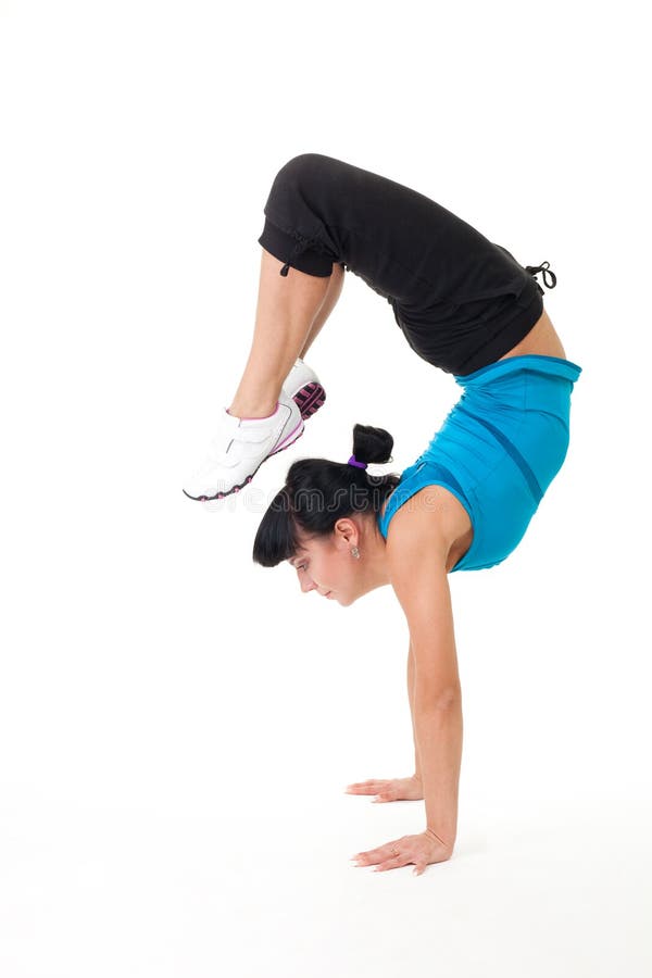 Woman do balance stretching exercise standing on hands on white background. Woman do balance stretching exercise standing on hands on white background