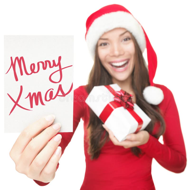 De vrouw die van Kerstmis exemplaar ruimteteken toont royalty-vrije stock foto's De vrouw die van Kerstmis exemplaar ruimteteken toont royalty-vrije stock foto's