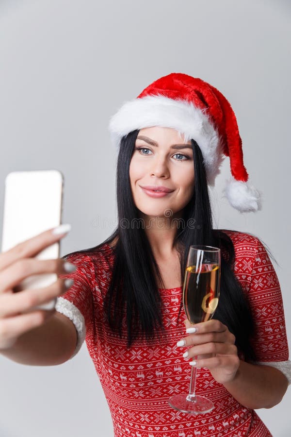 De vrouw in Kerstmis maakt selfie royalty-vrije stock fotografie De vrouw in Kerstmis maakt selfie royalty-vrije stock fotografie