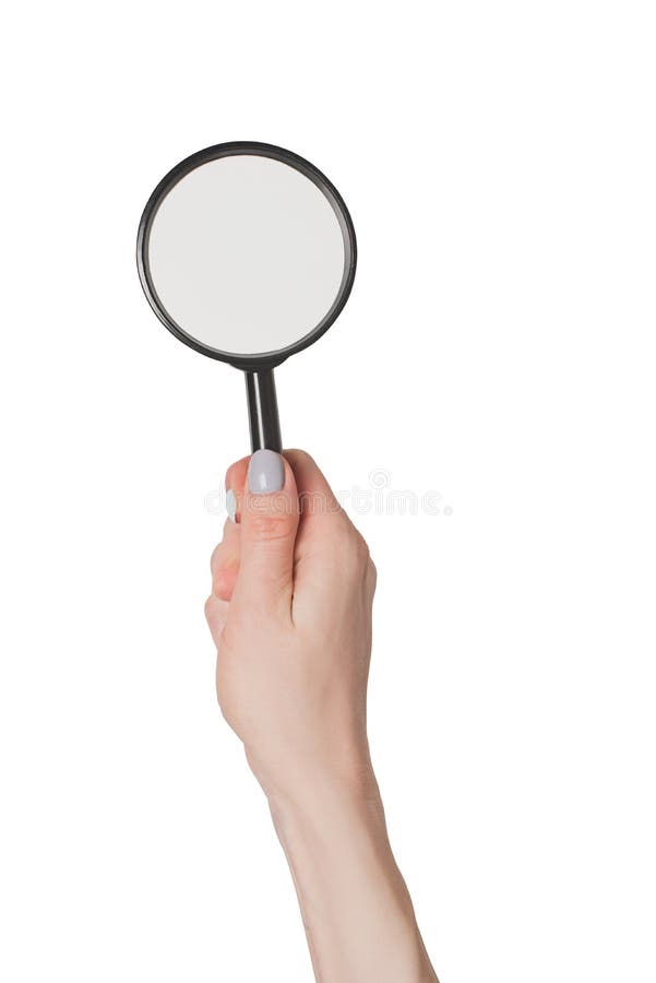 De vrouwelijke hand die meer magnifier isoleert op witte achtergrond houden stock afbeeldingen De vrouwelijke hand die meer magnifier isoleert op witte achtergrond houden stock afbeeldingen