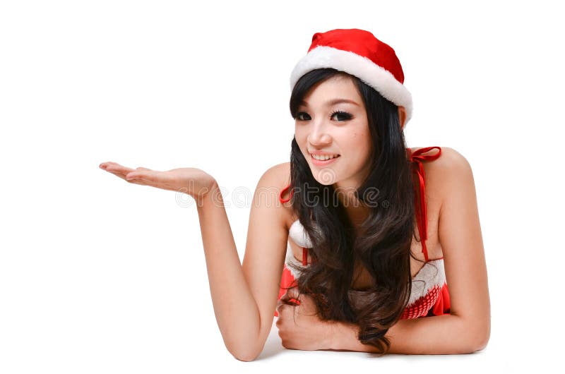 De vrouwen die van de kerstman iets op hand voorstellen royalty-vrije stock foto De vrouwen die van de kerstman iets op hand voorstellen royalty-vrije stock foto
