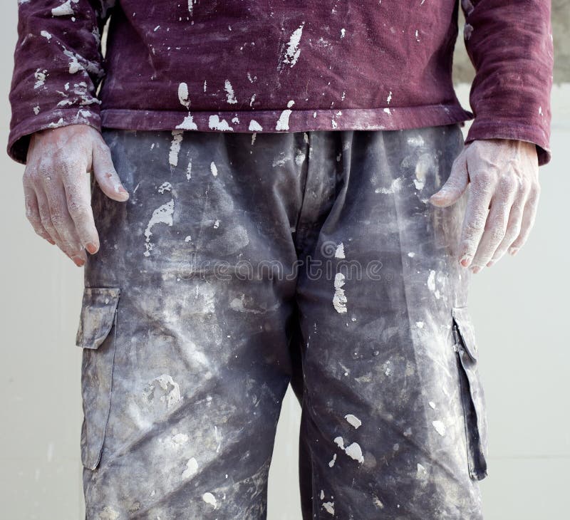 Hands and white dirty trousers detail of plastering painter man. Hands and white dirty trousers detail of plastering painter man