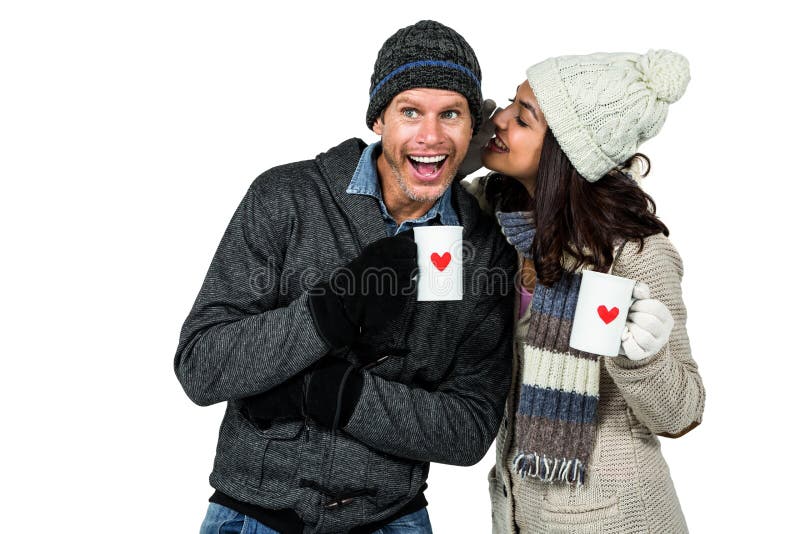 Winter couple enjoying hot drinks on white background. Winter couple enjoying hot drinks on white background