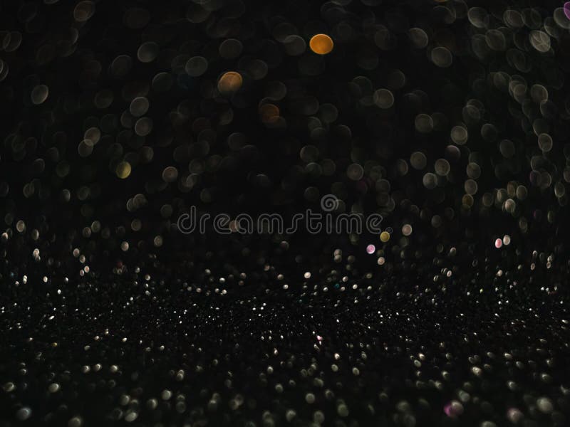 Zwarte bokeh-achtergrond met onscherpe lichten. stock fotografie