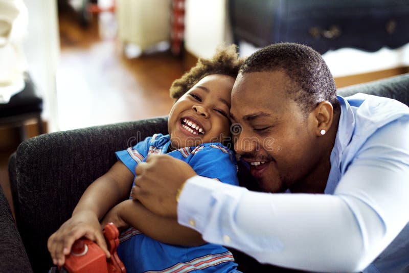 Black father enjoy precious time with his child together happiness. Black father enjoy precious time with his child together happiness