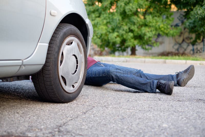 Dead pedestrian after a car accident in the street