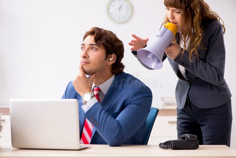 The Deaf Employee Using Hearing Aid Talking To Boss Stock Image Image