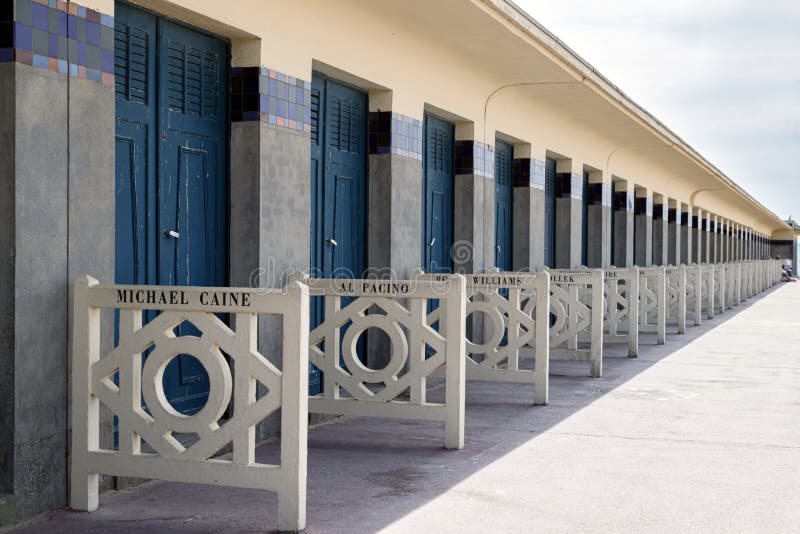 Deauville, France. The row of famous beach cabins with celebrity names on promenade des Planches.