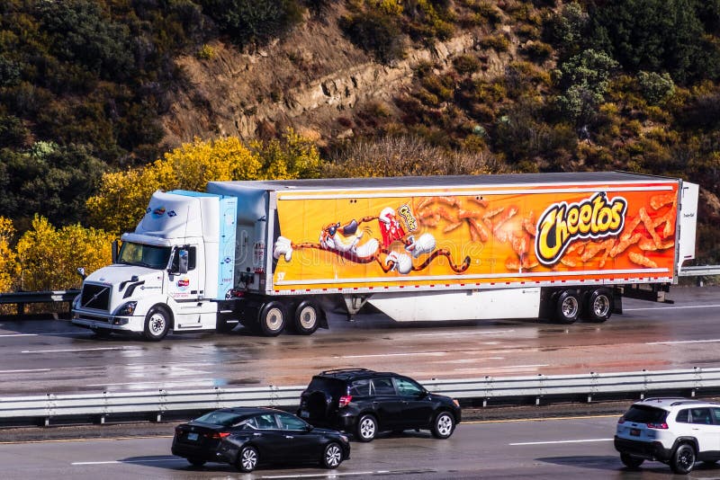 Dec 8, 2019 Los Angeles / CA / USA - Cheetos branded truck driving on the freeway; Cheetos is a brand of cheese-flavored puffed. Cornmeal snacks made by Frito royalty free stock photography Dec 8, 2019 Los Angeles / CA / USA - Cheetos branded truck driving on the freeway; Cheetos is a brand of cheese-flavored puffed. Cornmeal snacks made by Frito royalty free stock photography
