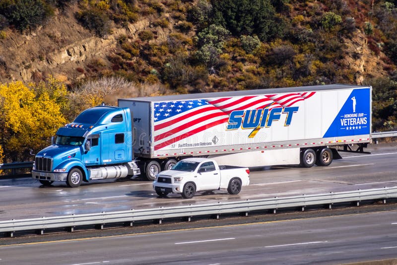 Dec 8, 2019 Los Angeles / CA / USA - Swift truck driving on the freeway; Swift Transportation is a Phoenix, Arizona-based American