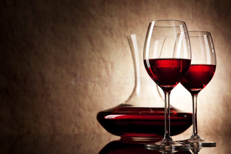 Decanter with red wine and glass