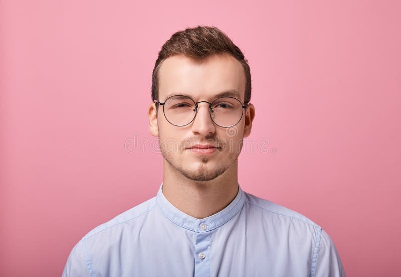 A Young Employee in a Sky Blue Shirt Stands on a Pink Background Stock ...