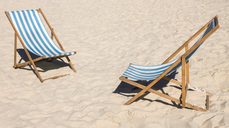 Deck chairs on the beach stock image. Image of equipment - 42695929