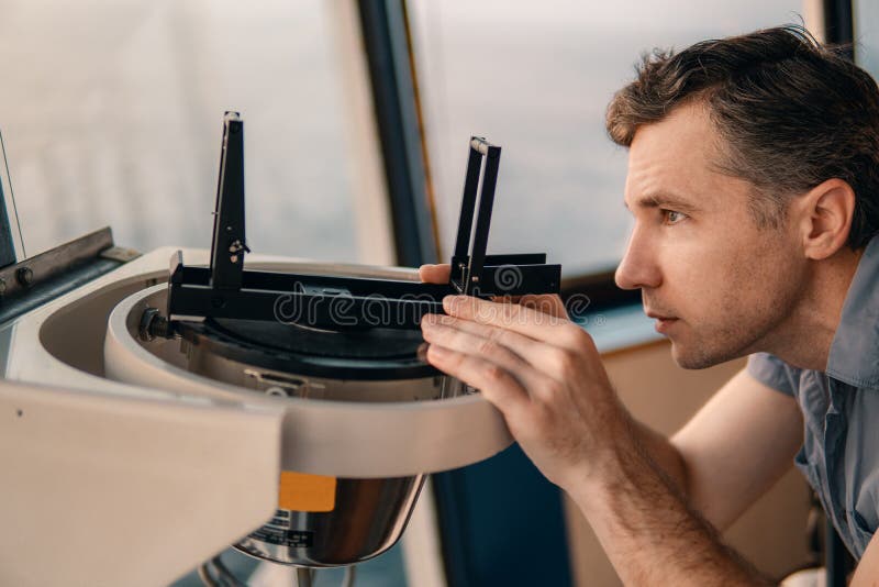 Deck Officer Taking Compass Error Onboard of Vessel Stock