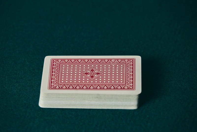 A Deck of Red Cards on the Green Game Mat Stock Photo Image of
