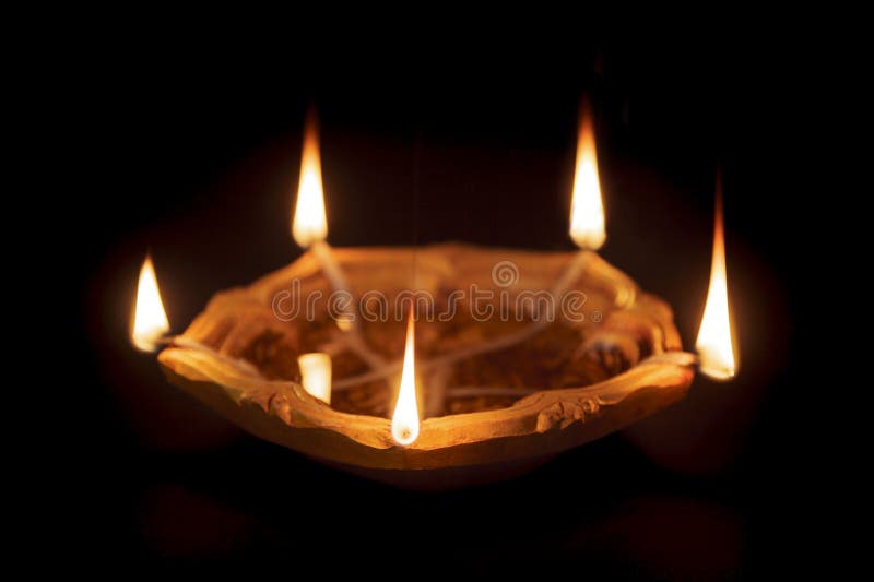 Closeup of a Declarative Earthen Oil Lamp or Diya on Dark Background ...