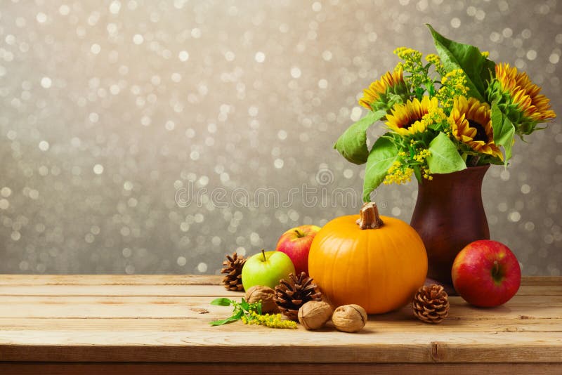 Thanksgiving holiday table decoration with sunflowers and fresh pumpkin. Thanksgiving holiday table decoration with sunflowers and fresh pumpkin