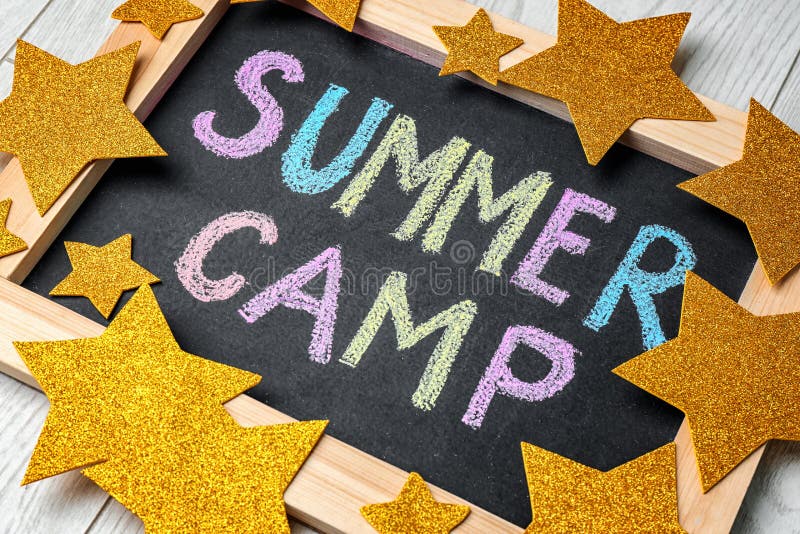 Decorated blackboard with text SUMMER CAMP stock image Decorated blackboard with text SUMMER CAMP stock image