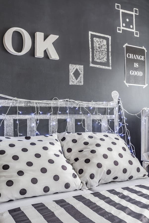 Decorated Blackboard Wall in a Black and White Bedroom Stock Photo