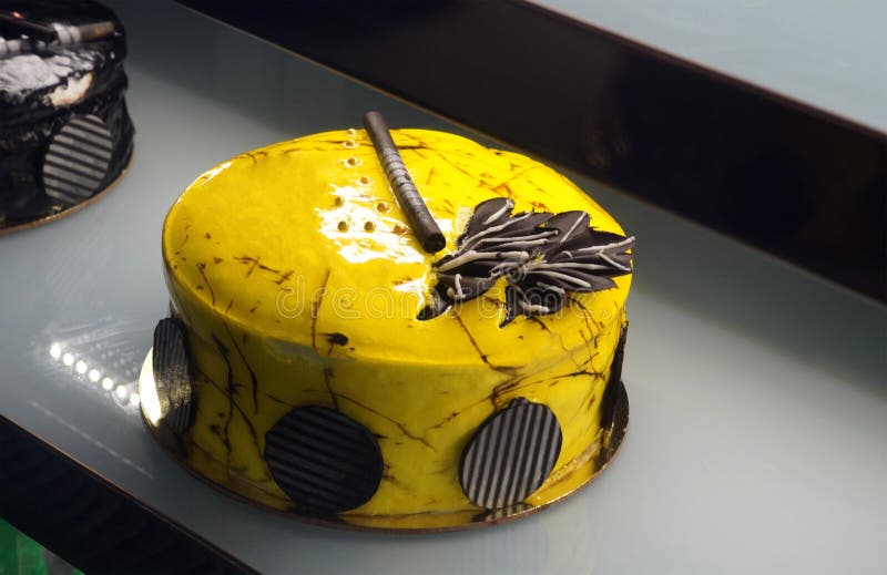Decorated Cake in Refrigerated Display Unit of a Bakery Shop Stock