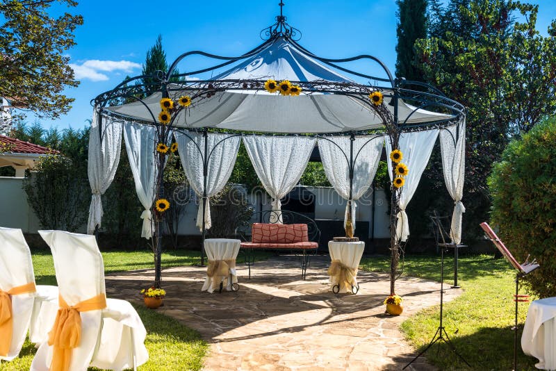 Decorated Chairs on a Outdoor Wedding Stock Image - Image of candle