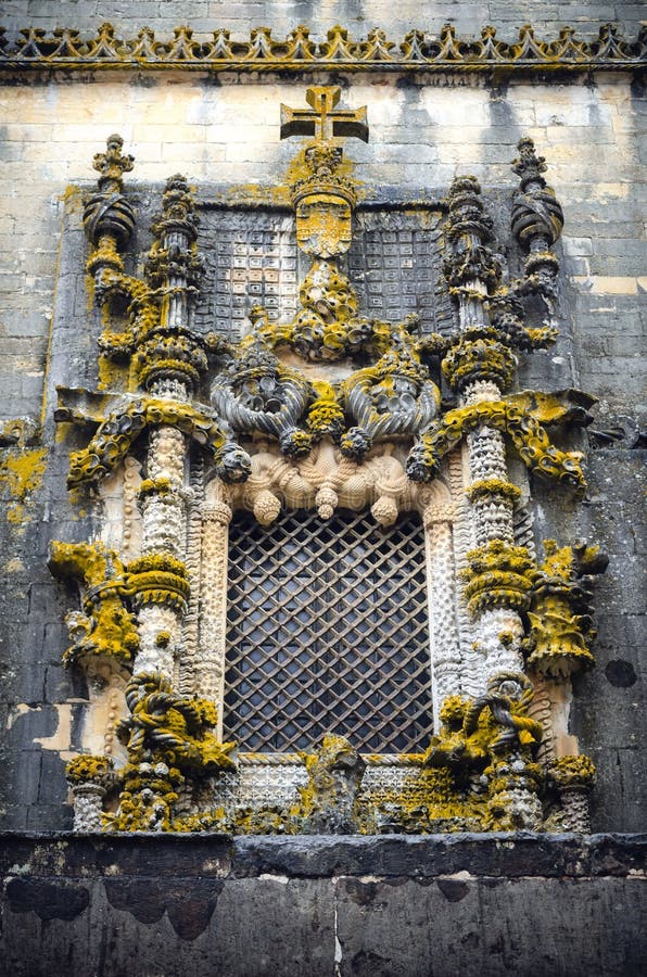 The decorated chapterhouse window of the convent of christ, ancient templar stronghold and monastery in Tomar, Portugal stock image The decorated chapterhouse window of the convent of christ, ancient templar stronghold and monastery in Tomar, Portugal stock image