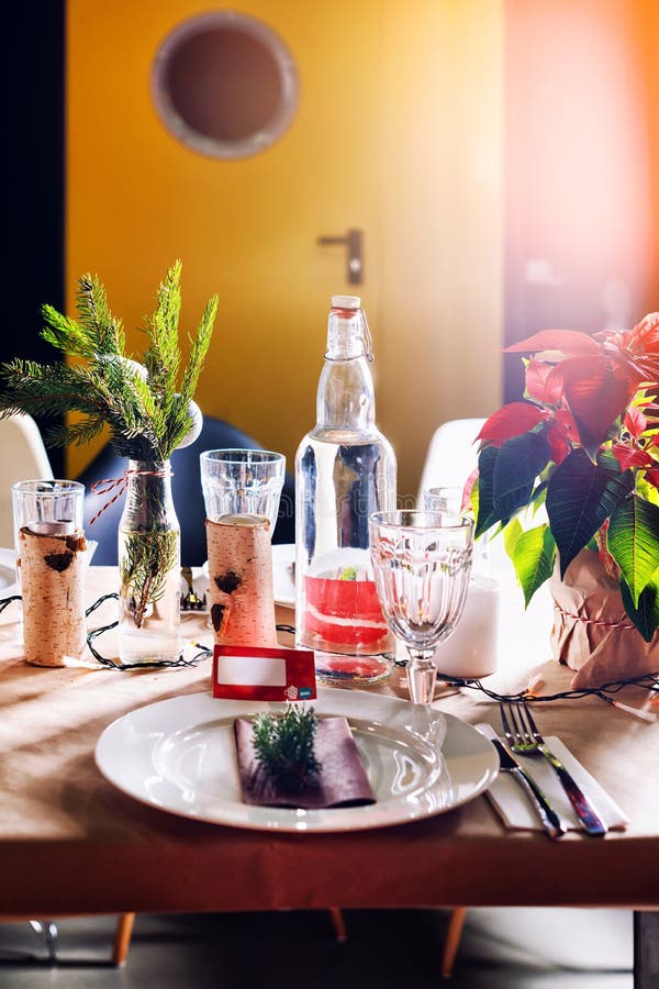 Decorated Christmas holiday table ready for dinner. Cold, bright.