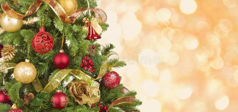 Christmas Tree Defocused Background with Wooden Table in Front Stock