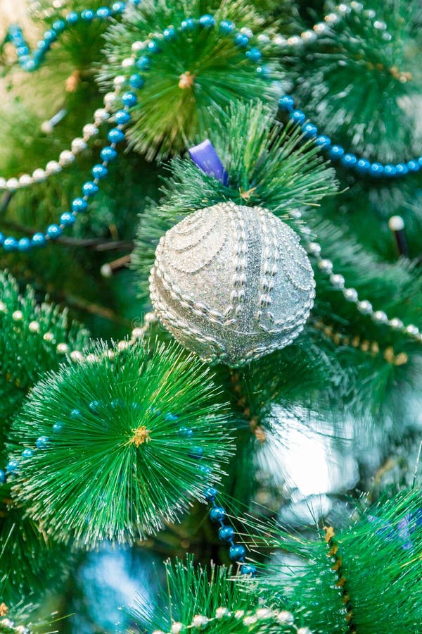 Decorated Christmas Tree with Blue Lights. White Christmas Ball and