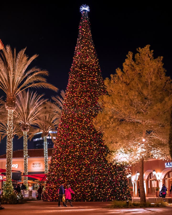 Decorated Christmas Tree in the Mall, Happy People Walking by the the