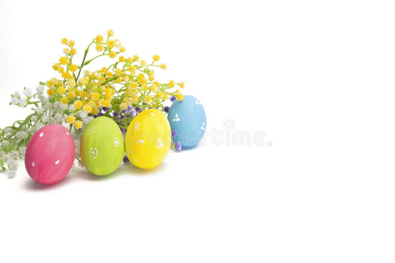 Decorated Easter eggs with colorful wildflowers isolated stock photo