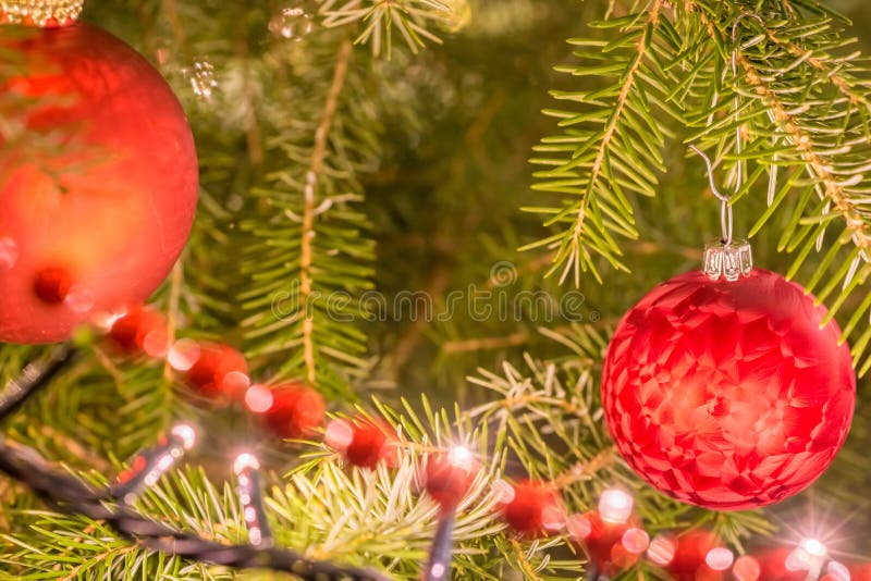 Decorated with fairy lights, Christmas balls and string of pearls Christmas tree in detail royalty free stock photo Decorated with fairy lights, Christmas balls and string of pearls Christmas tree in detail royalty free stock photo