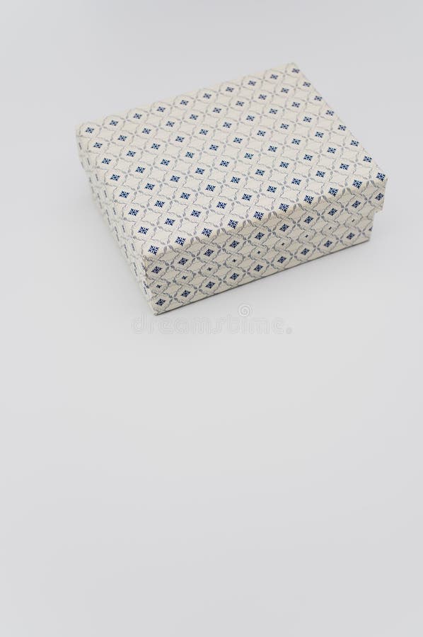 Decorated Paperboard Box with Lid on Top on a White Background Stock