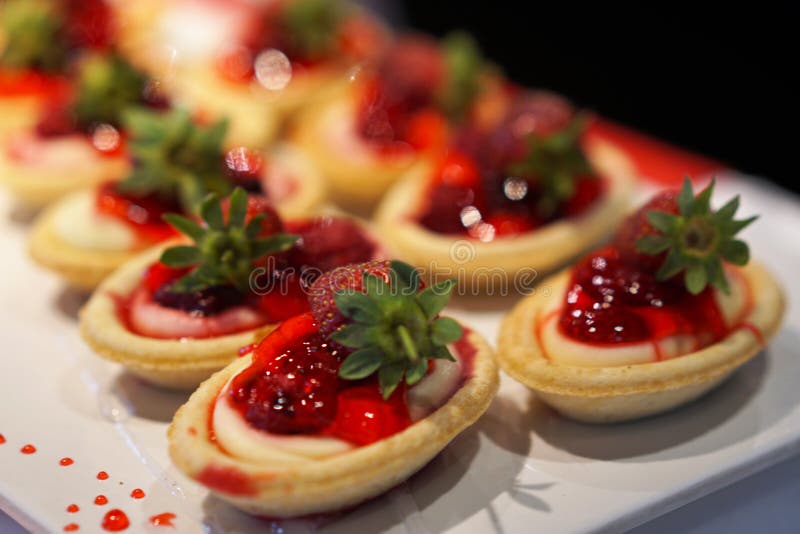 Delicious strawberry cakes on a open buffet stock photos