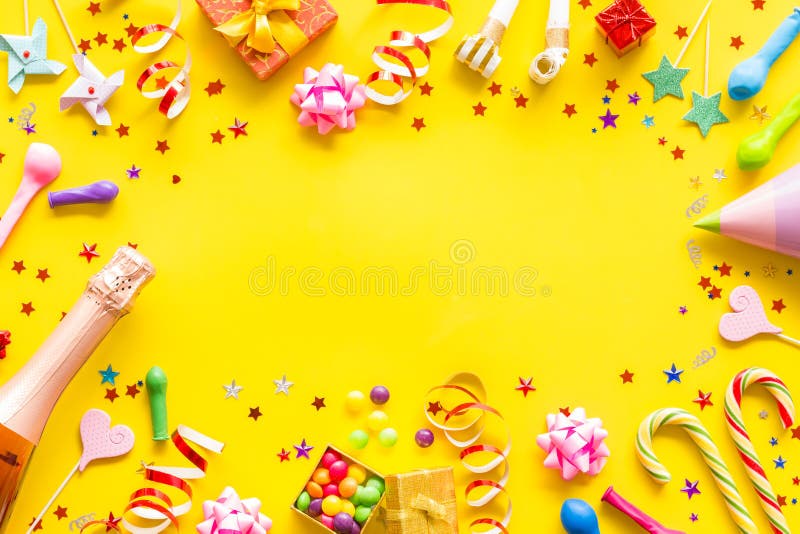 Decoration for party frame on yellow background top view mockup royalty free stock image Decoration for party frame on yellow background top view mockup royalty free stock image