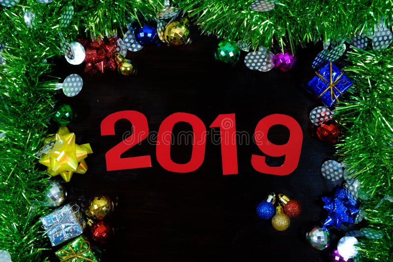 Decorations background with ornaments for new year 2019 on wooden. Decorations background with ornaments for new year 2019 on wooden