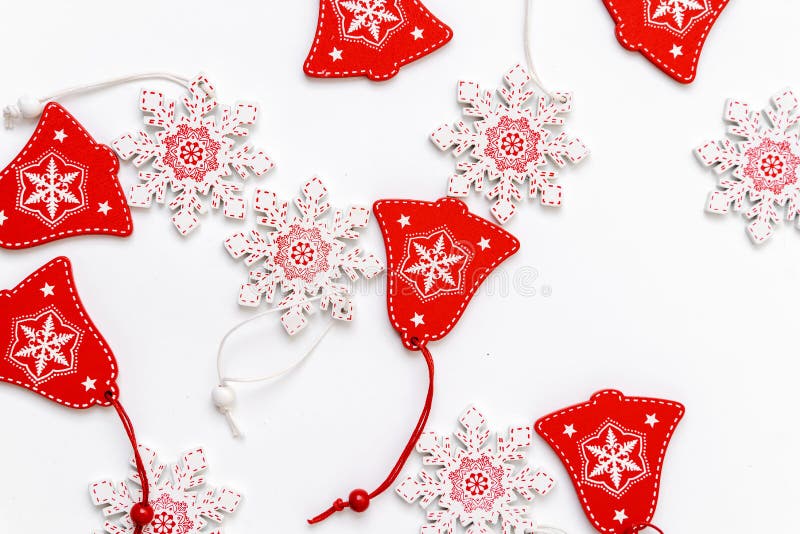 Decorations of Christmas tree wooden red and white snowflakes and bells with ornament. Background winter royalty free stock photo Decorations of Christmas tree wooden red and white snowflakes and bells with ornament. Background winter royalty free stock photo
